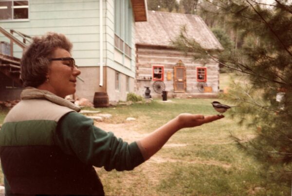 Mary Davis with a chickadee in her hand